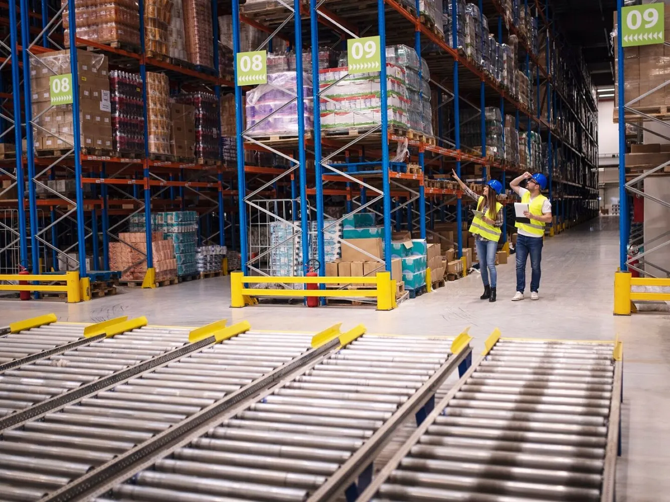 Warehouse workers checking inventory and goods distribution 
