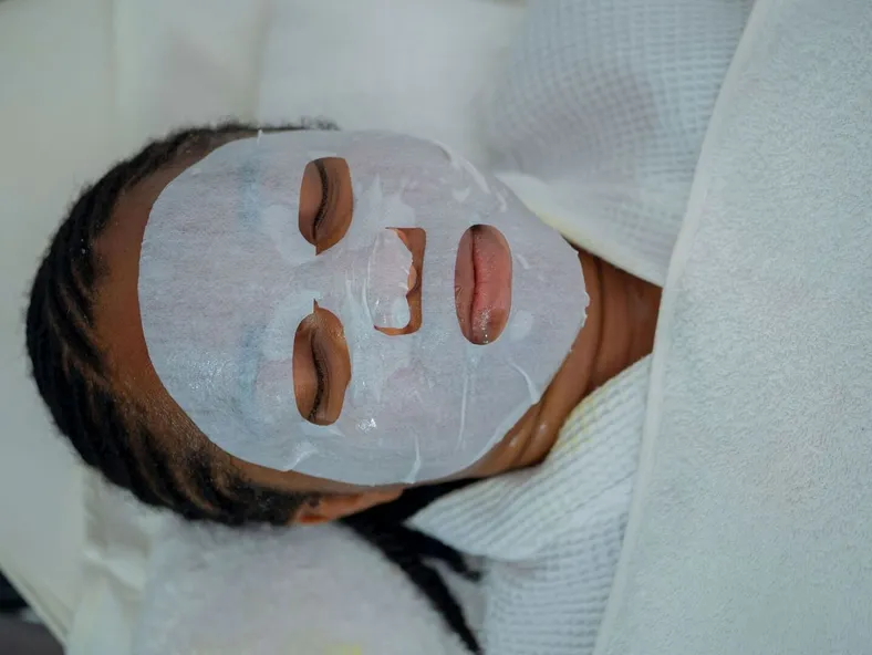 Woman enjoying a rejuvenating facial mask treatment at a spa