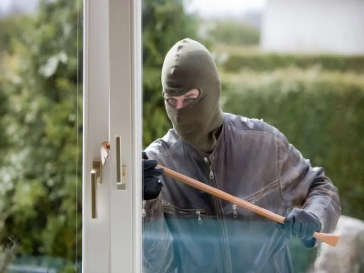 Burglar breaking in
