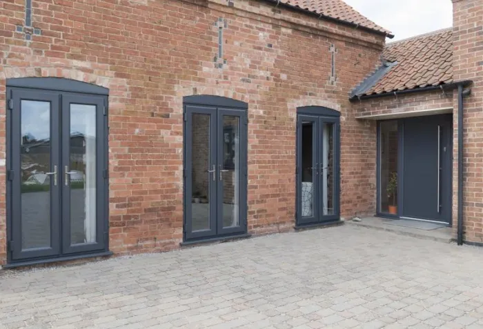 Flush sash French doors in dark grey