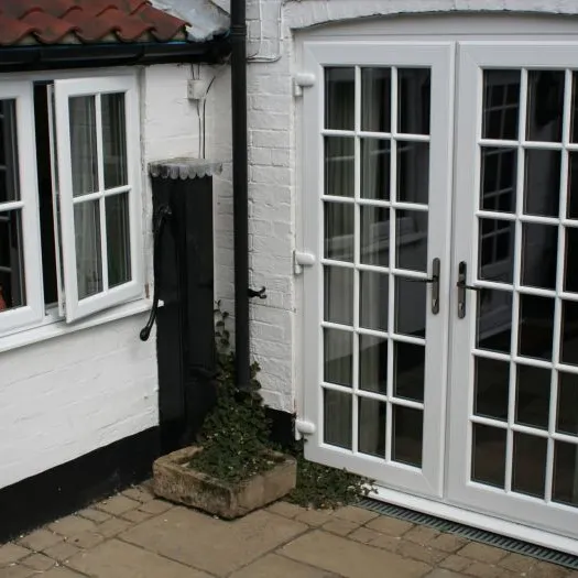 French doors with white brick courtyard