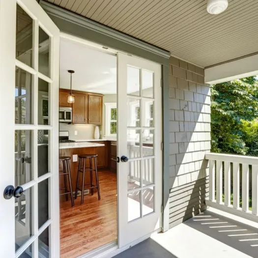 French doors open onto a patio