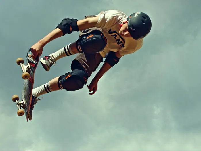 Skateboarder with orange shirt