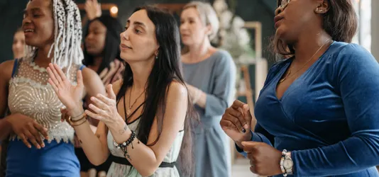 A Group of Women Singing Together