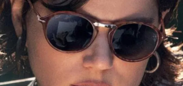 Woman wearing Persol sunglasses