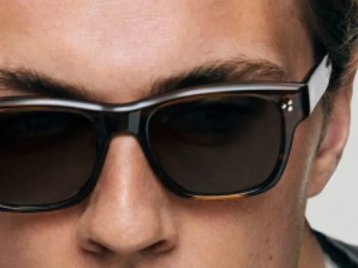Man wearing Oliver Peoples sunglasses