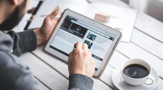 Man using stylus pen for touching the digital tablet screen