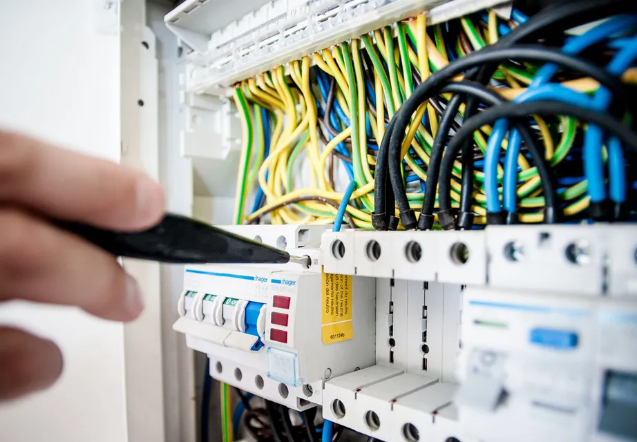 Electrician working on an electric circuit board