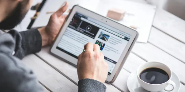 Man using stylus pen for touching the digital tablet screen