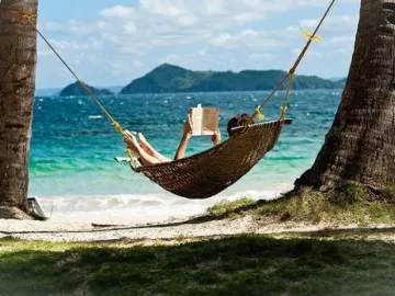 reading in a hammock on the beach