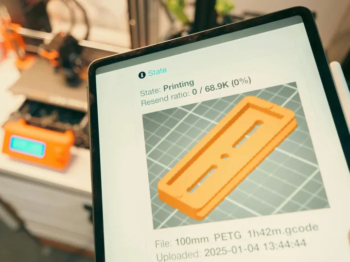 Close-up of a digital tablet displaying a 3D print