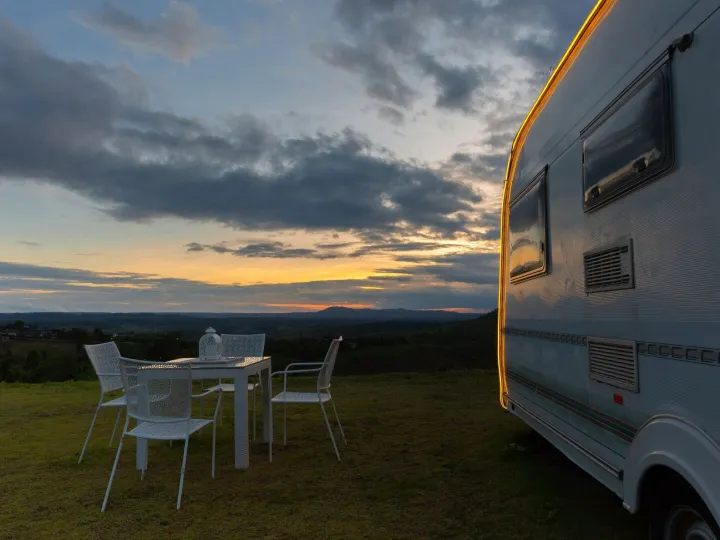 Campsite with caravans at dusk time