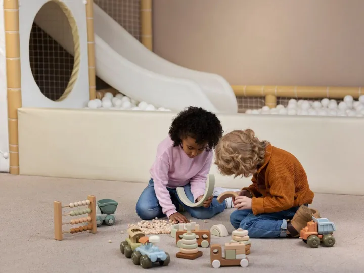 Full shot kids playing with eco toys indoors