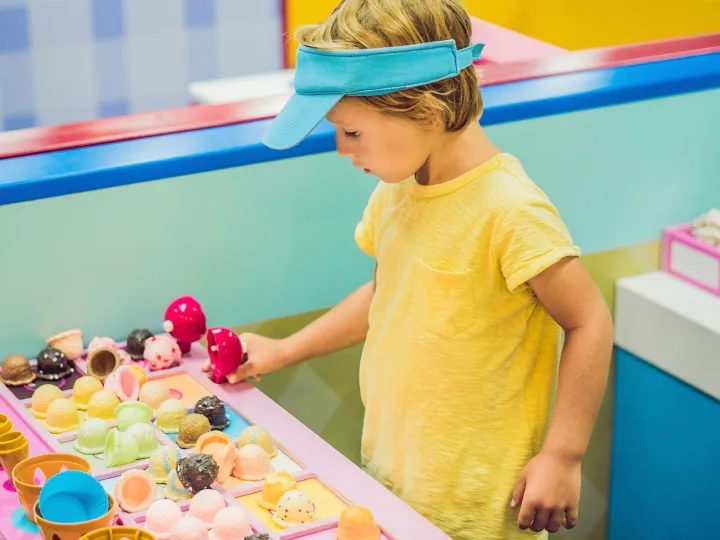 Children play as ice cream seller.