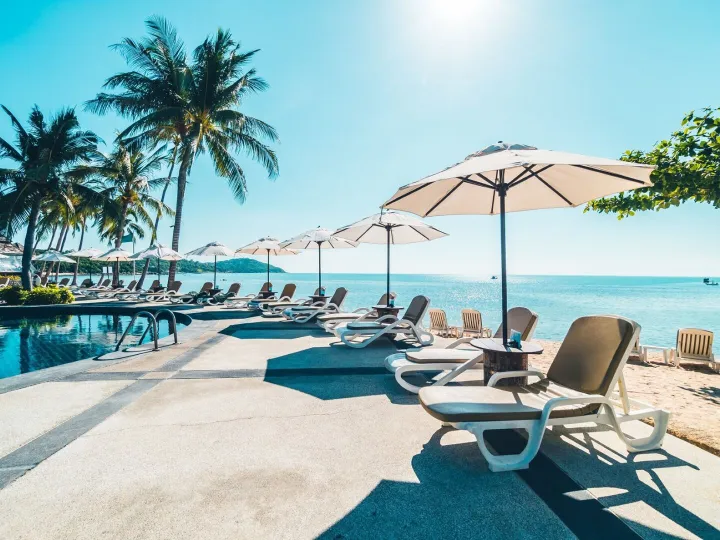 Beautiful tropical beach and sea with umbrella