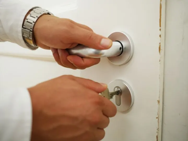 Hand locking a door