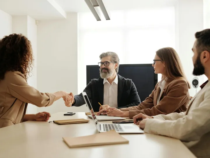 Colleagues in an office celebrating a successful