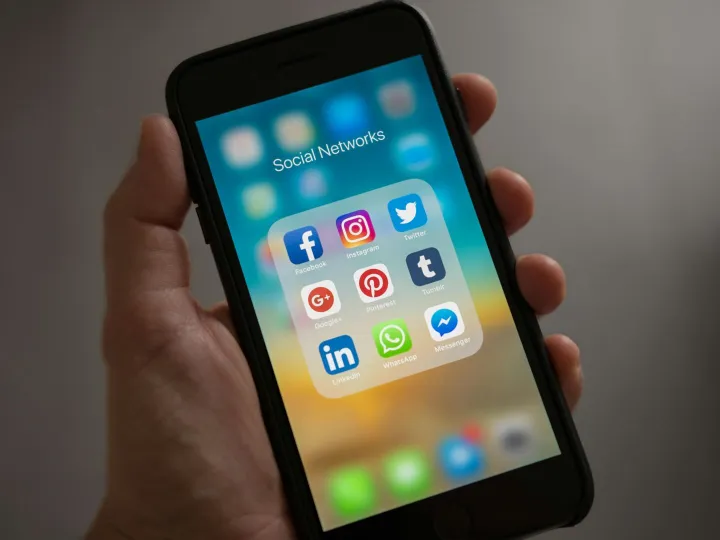 A smartphone displaying various social media