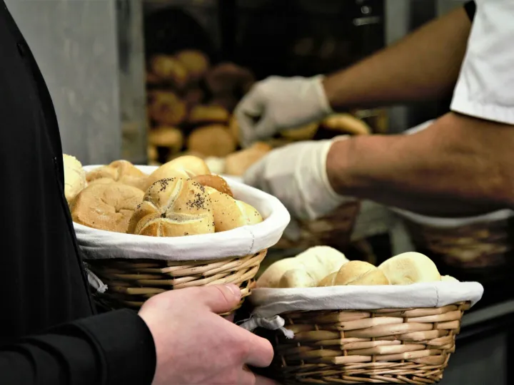 Close-up of fresh bread in woven baskets at a bake