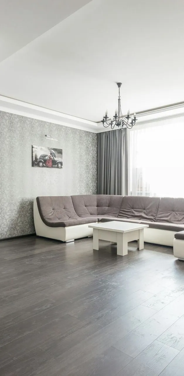 View of empty spacious living room with wooden