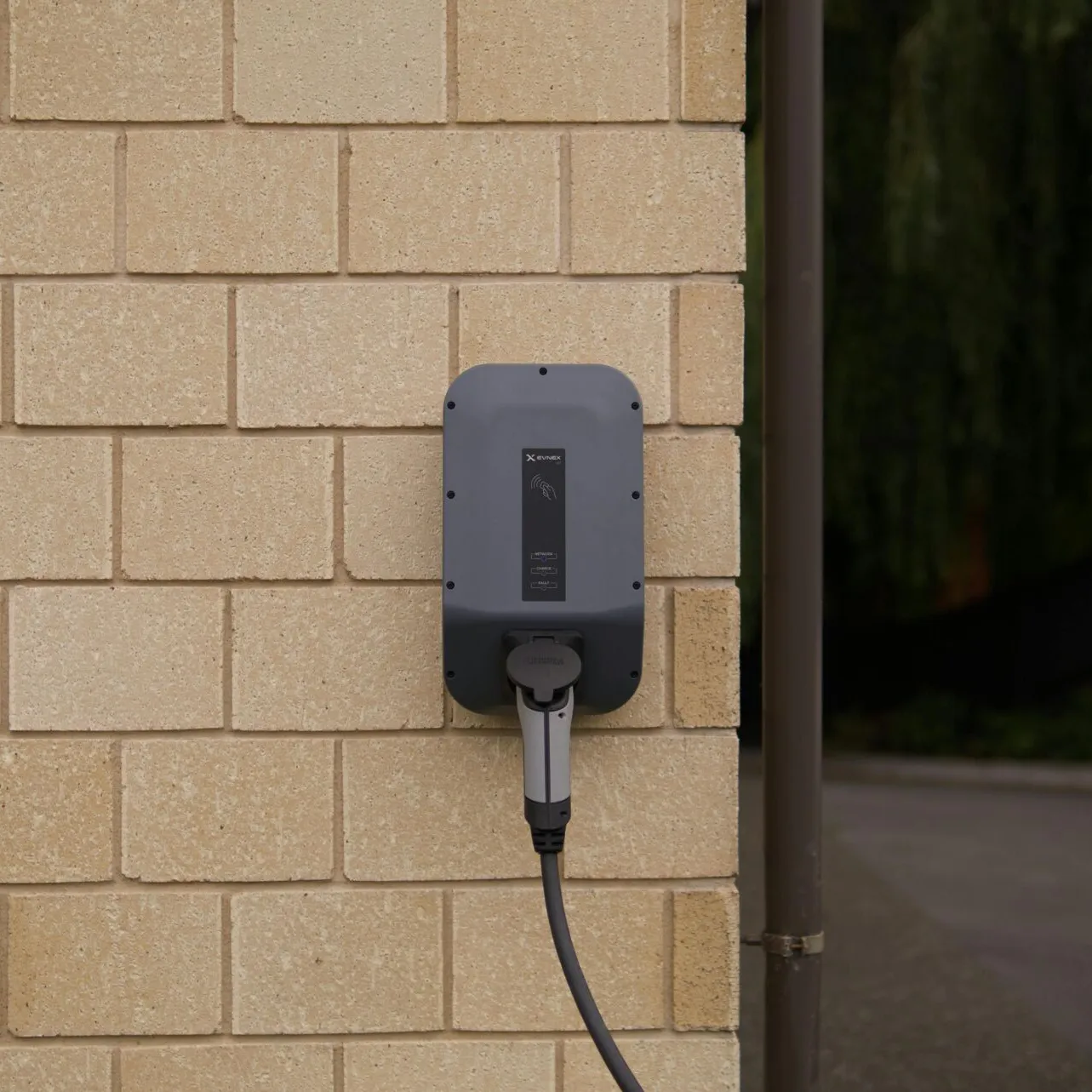 A wall-mounted electric vehicle charging station