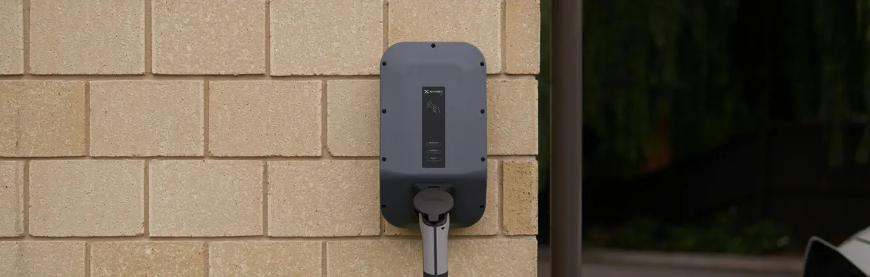 A wall-mounted electric vehicle charging station