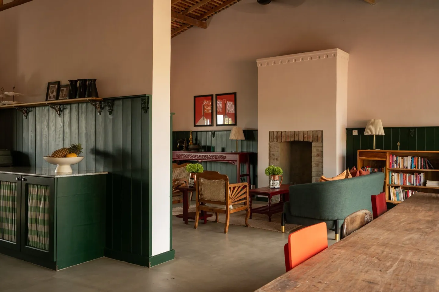 The lounge and dining area with green panelling at Peacock Hill Sigiriya