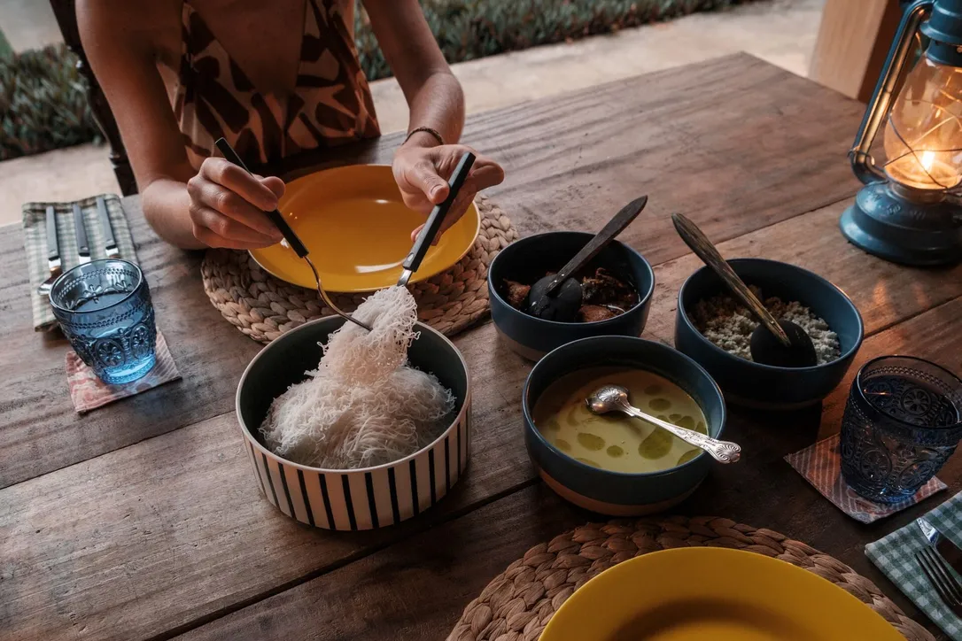 A traditional Sri Lankan rice and curry lunch served in clay bowls at Peacock Hill Sigiriya
