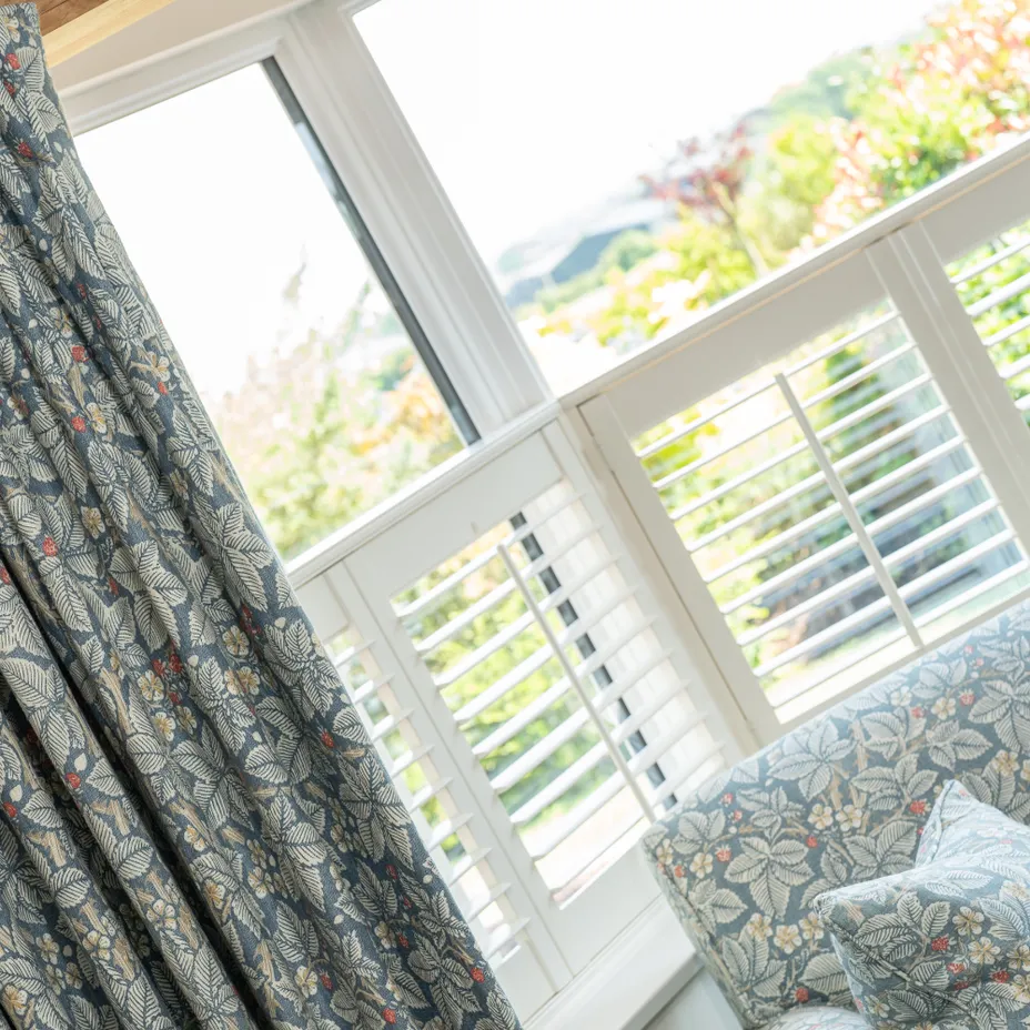 Shutter blinds with grey curtains