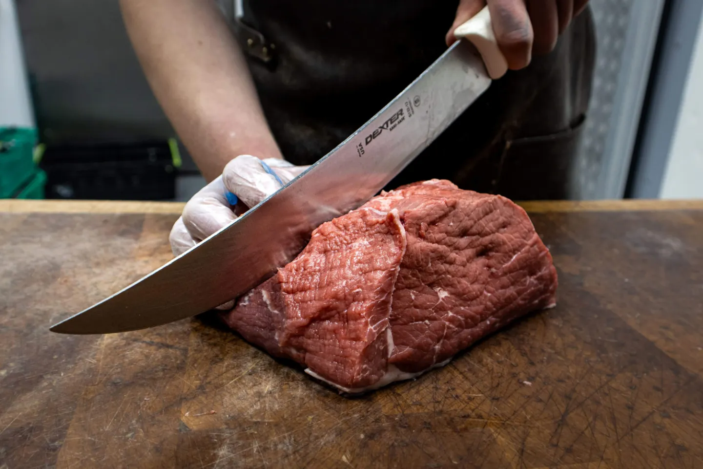 slicing beef on chopping board