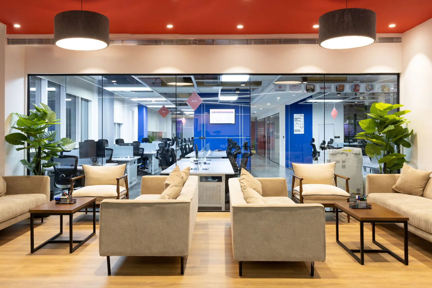 Office seating area with glass walls and plants