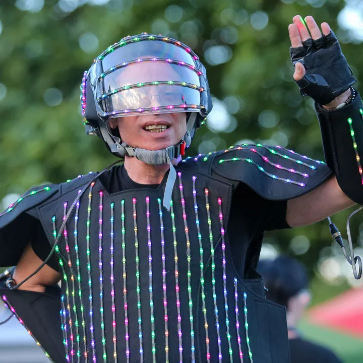 Audience Member in An Illuminated Suit
