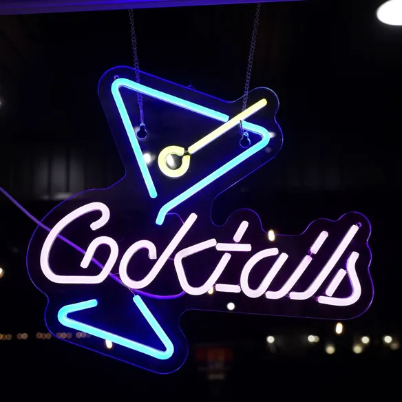 Neon cocktails sign above the bar