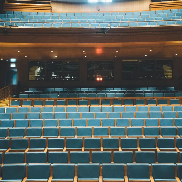 Theatre auditorium with blue seats