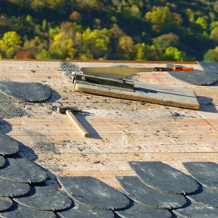 Slates being replaced on a chapel roof