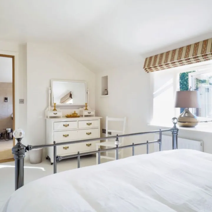 Bedroom two at Otters Retreat with a king size bed and its own en suite