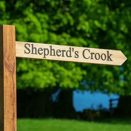 The wooden Shepherd’s Crook signpost at Mellor Knowl Farm