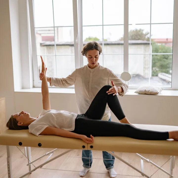Sports rehabilitation session on a treatment couch