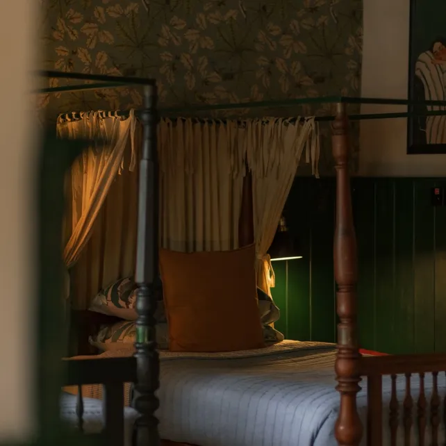 A hundred year old four poster bed in the Lake View Suite at Peacock Hill Sigiriya