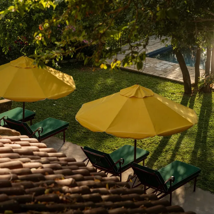 The pool and parasols seen from the 360 View Suite at Peacock Hill Sigiriya
