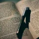 Close-up of a ballpoint pen resting between the