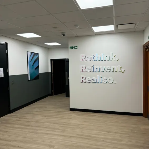 An office wall decorated with inspiring slogans