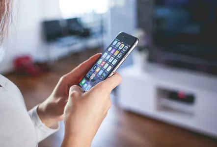 Woman Wearing White V Neck Shirt Using Space Gray Iphone 6