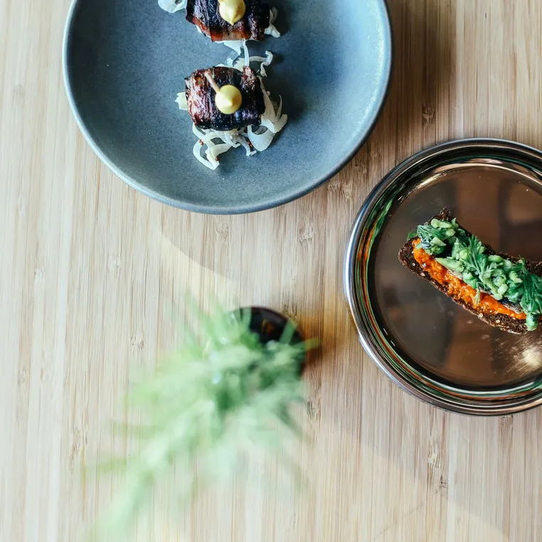Plated dishes on a wooden table, seen from above