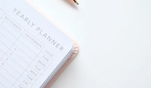 A stylish yearly planner open to a 2020 calendar