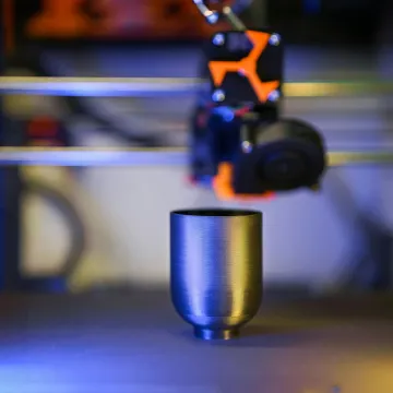 Innovative close-up of 3D printer crafting a metal