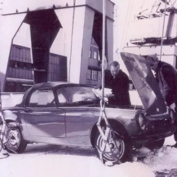 Car ready for hoisting onto the waiting ship