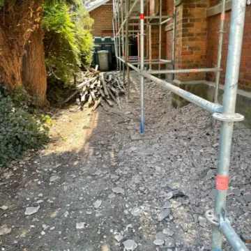 Removing the old wattle and daub roof