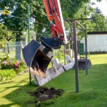 Mini digger in a domestic garden