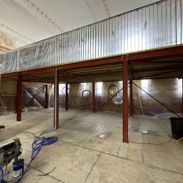 Industrial unit with raised mezzanine structure